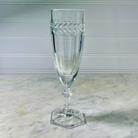 Clear glass goblet with decorative pattern on a marble surface Vintage Villeroy & Boch Miss Desiree Champagne Flutes