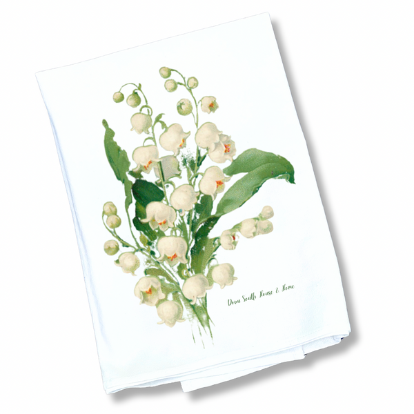 Floral design on a white towel with green leaves - lily of the valley tea towel