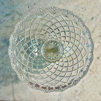 Clear glass bowl with intricate cut patterns on a marble surface Vintage Brussels Bowl by Crystal Clear Industries