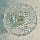 Clear glass bowl with intricate cut patterns on a marble surface Vintage Brussels Bowl by Crystal Clear Industries