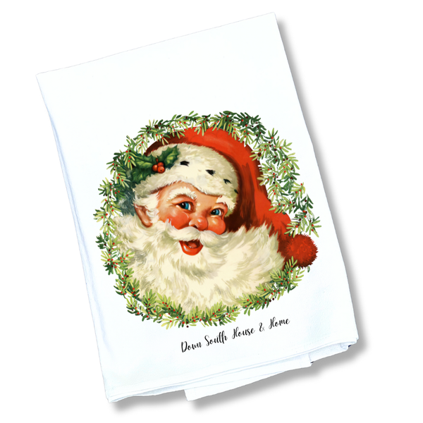 Tea towel with a vintage-style illustration of Santa Claus on a white background